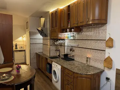 a kitchen with a washer and dryer on a counter at Mini Hotel-Bohemi in Plovdiv