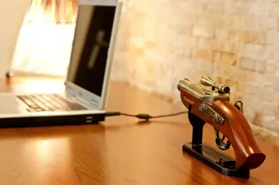a pair of scissors on a table next to a laptop at Hotel Cheap - Smart choice - Great value in Sofia