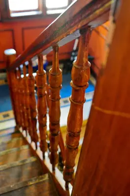 a close up of a wooden stair railing at L'Opera Guest House in Sofia