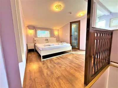 a bedroom with a bed in a room at L'Opera Guest House in Sofia