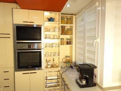 a kitchen with white cabinets and a counter with a microwave at Apartment SOFIA LUX TOP CENTER in Sofia