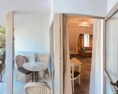 a view of a room with a table and chairs at ATLAS HOUSE Luxury Suites in Plovdiv