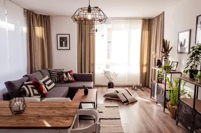 a living room with a couch and a table at Baba Taki Apartment in Plovdiv