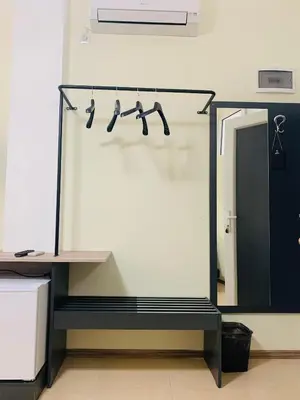 a room with a rack of hangers on a wall at Agora Studios in Plovdiv
