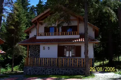 a house with a porch and a balcony at Saint George Holiday Village in Borovets