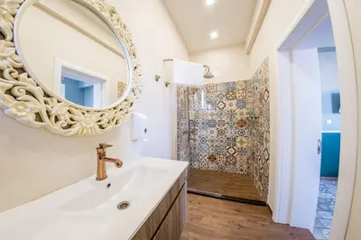 a bathroom with a sink and a mirror at Sofia Vintage Life Apartment in Sofia