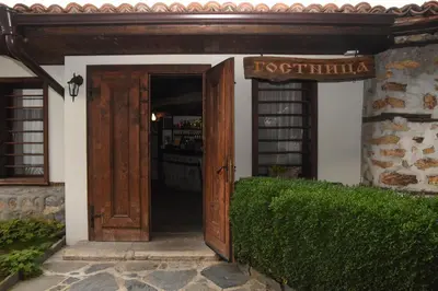 an entrance to a building with an open door at Djudjeva Kyshta Hotel in Panagyurishte