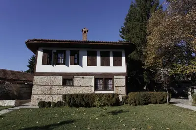 an old stone house with a tile roof at Djudjeva Kyshta Hotel in Panagyurishte