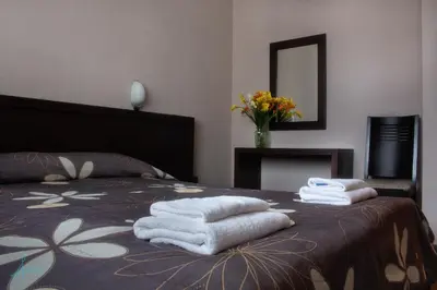 a group of towels sitting on top of a bed at Ostrova Holiday Village in Beli Osŭm