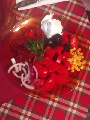 a glass bowl of food with vegetables and sour cream at Семеен хотел НАЦИОНАЛ in Mineralni Bani