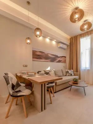 a living room with a table and a couch at Sofia Dream Apartment - Premium One Bedroom on Ekzarh Yosif by Flat Mаnager in Sofia
