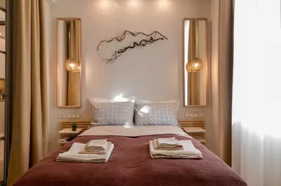 a bedroom with a bed with two towels on it at Sofia Dream Apartment - Premium One Bedroom on Ekzarh Yosif by Flat Mаnager in Sofia