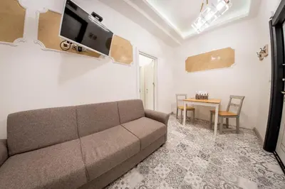 a living room with a couch and a table at Sofia Pearl Life Apartment - No Window Apartment in Sofia