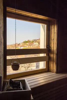 a window with a view of the beach from a sink at SABORNA 25 GUEST HOUSE in Plovdiv
