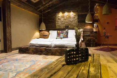 a bedroom with a large bed in a room at SABORNA 25 GUEST HOUSE in Plovdiv