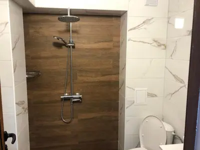 a bathroom with a shower with a toilet at Студиа КРИСИ in Sandanski