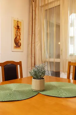 a table with a potted plant sitting on top of it at GLORIOUS - 2-Bedroom apartment near Youth Hill by Flat Mаnager in Plovdiv