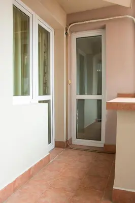 an entrance to a house with a glass door at GLORIOUS - 2-Bedroom apartment near Youth Hill by Flat Mаnager in Plovdiv