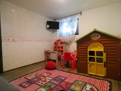 a childs play room with a toy dog house at Ice Jewel Chalet, Bansko, 200 meters from the Gondola, 20 улица „Свети Иван Рилски“ in Bansko