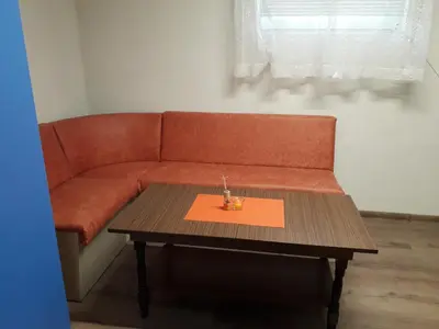 a living room with a couch and a coffee table at Апартамент 