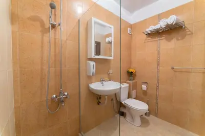 a bathroom with a shower and a toilet and a sink at Comfort.Chic.Charming Apt with Terrace near NDK in Sofia