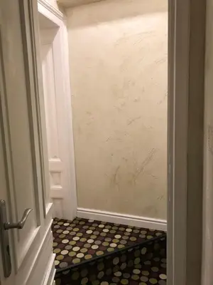 a door leading to a hallway with a tile floor at Come inn - 24h Self Check-in in Sofia