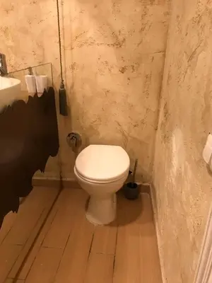 a bathroom with a toilet and a sink at Come inn - 24h Self Check-in in Sofia