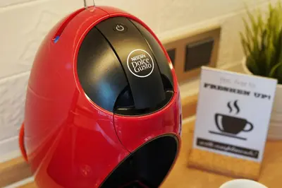 a red computer mouse sitting on top of a table at Apartment Audrey by SofiaSpot - central, metro to airport in Sofia