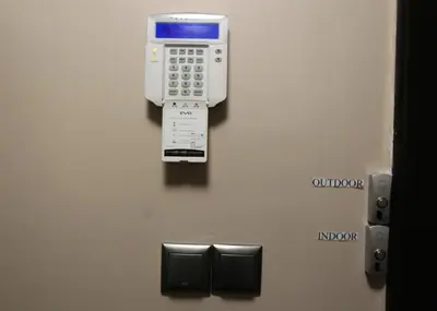 a phone on the wall of an elevator at NIKI Apart in Sofia