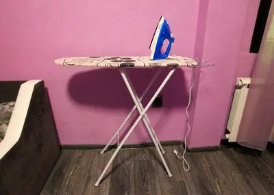 a table with a laptop sitting on top of it at NIKI Apart in Sofia