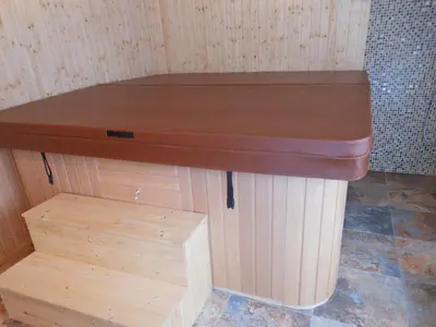 a wooden table in a room with a wooden shelf at Guest House Goranovi in Velingrad