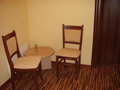 a small table and two chairs and a table and chairs at Guest House Goranovi in Velingrad