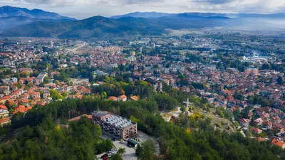 an aerial view of a city with trees and buildings at Hotel Panorama Velingrad in Velingrad