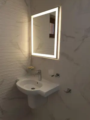 a white bathroom with a sink and a mirror at хотел Чифлика - комплекс Чифлика in Chiflik