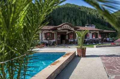 a resort with a pool in front of a building at хотел Чифлика - комплекс Чифлика in Chiflik