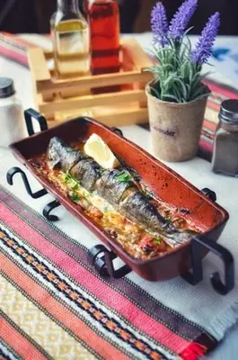 a tray of food sitting on a table at Zlatna ribka in Kokolyane