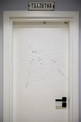 a white door with a map on it at Courthouse Apartments Slavi in Sofia