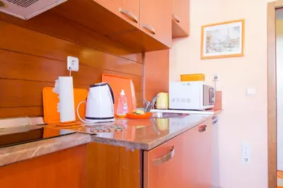 a kitchen with a counter with a coffee maker on it at Orange Flower Apartments in Sofia