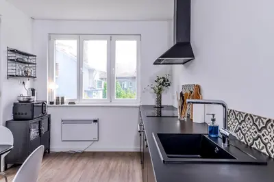 a kitchen with a sink and a counter top at 66 Apartment - Stylish Two Bedroom in Lozenets District by Flat Mаnager in Sofia
