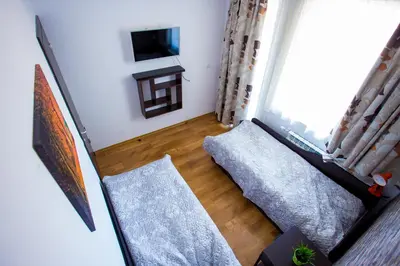 a living room with a couch and a window at Apartment IVA - Iglika 2 in Borovets