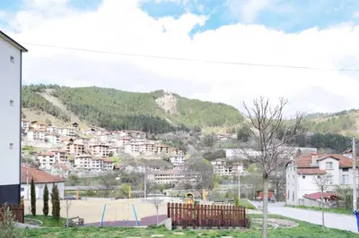 a view of a town with a playground at СТАИ ЗА ГОСТИ МЗ-ДЕВИН in Devin