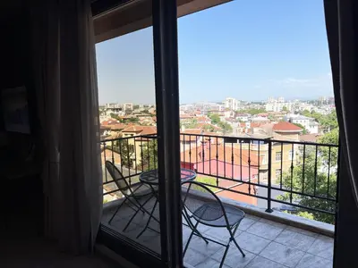 a view of a balcony with a table and chairs at Clepsydra Residence in Plovdiv