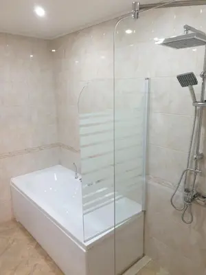 a shower with a glass door in a bathroom at Clepsydra Residence in Plovdiv