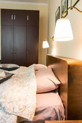 a bedroom with a bed with a lamp on it at Bright and Cozy 2BD Flat in Plovdiv City Centre by Flat Mаnager in Plovdiv