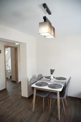 a dining room with a table and chairs at Roma Apartment in Sandanski
