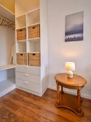 a room with a table and a closet with baskets at South Park, Vitosha View, 2-BDR, 2-BTHR Apartment by Flat Mаnager in Sofia