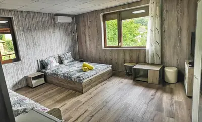 a bedroom with a bed with a yellow object on it at Bali Petrich in Petrich