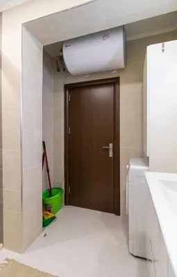 a bathroom with a brown door and a green bucket at Pop your COLORS - Funky and Modern 1BDR Apt by Flat Mаnager in Plovdiv