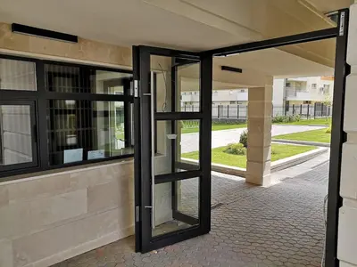 a pair of glass doors in a building at Business and Leisure apartments in Mladost 2 with FREE Garage in Sofia