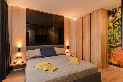 a bedroom with a bed with two towels on it at Urban Eden - LUX & STYLE, 2-Bedroom, 2-Bathroom in Sofia